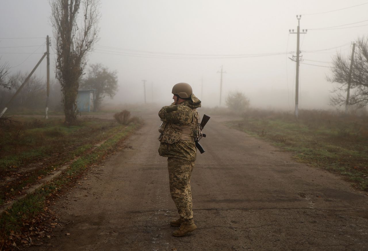 A Ukrainian serviceman stands on a street in a village near the newly recaptured city of?Snihurivka, in the Mykolaiv region, Ukraine, on November 10.