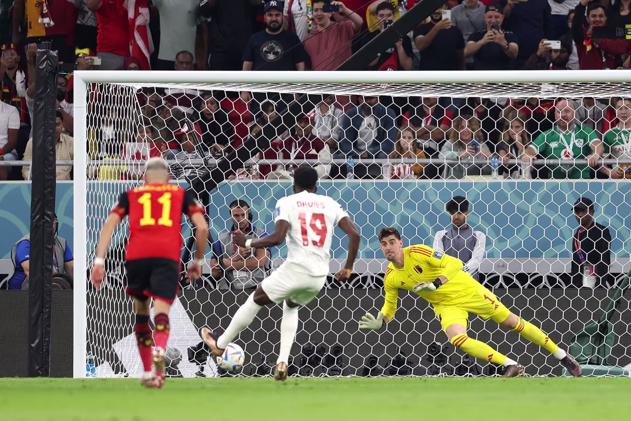 Thibaut Courtois of Belgium saves the penalty taken by Alphonso Davies of Canada on November 23.