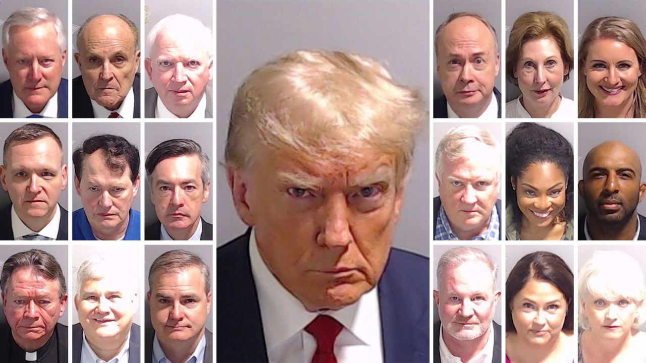 Top row: Mark Meadows, Rudy Giuliani, John Eastman, Jeffrey Clark, Sideny Powell Middle row: Mike Roman, Ray Smith, Kenneth Chesebro, Robert Cheeley, Trevian Kutti, Harrison Floyd Bottom row: Stephen Lee, David Shafer, Shawn Still, Scott Hall, Misty Hampton, Cathy Latham Center: Donald Trump. 