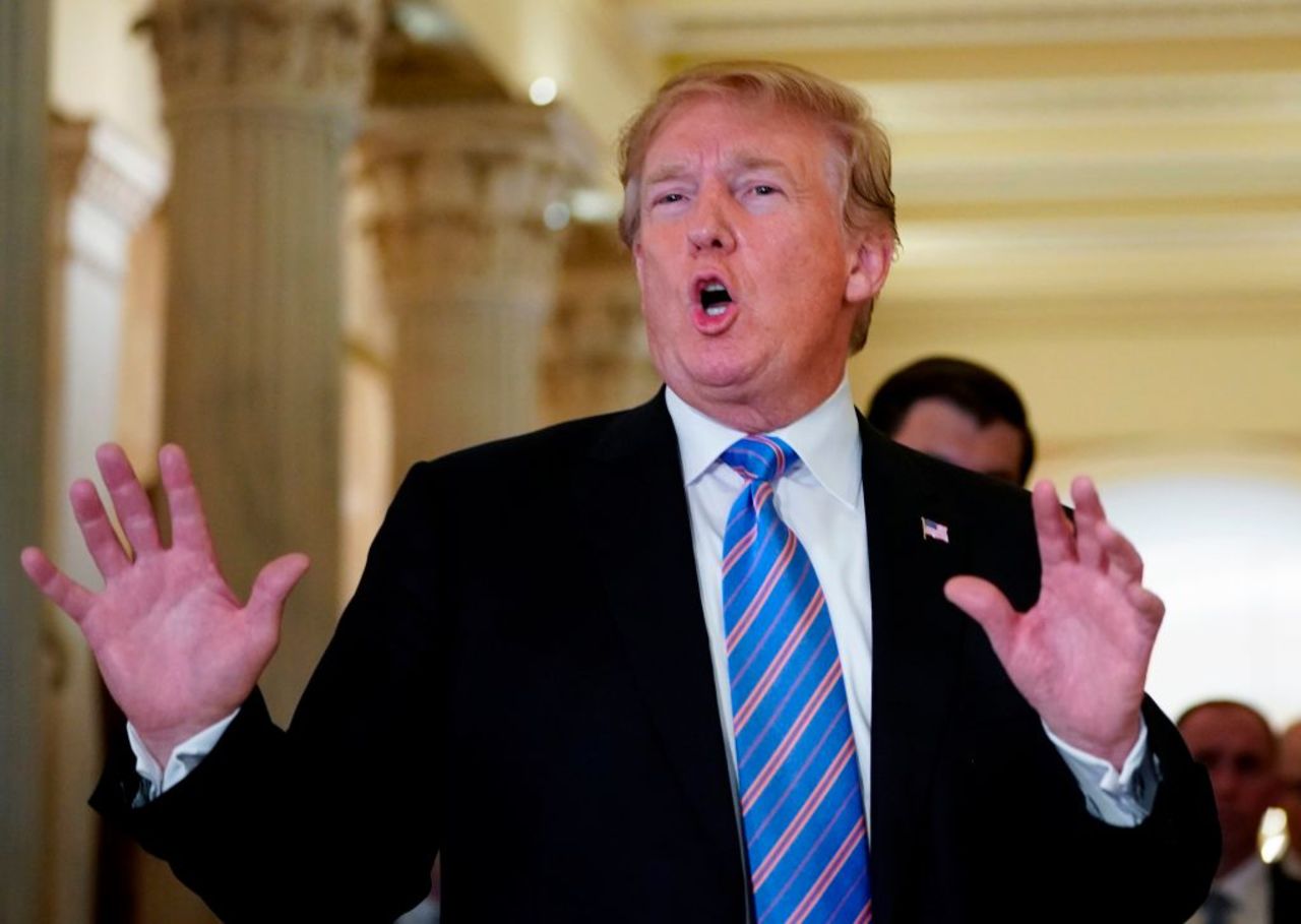 US President Donald Trump speaks with the press after a meeting at the US Capitol with the House Republican Conference in Washington, DC on June 19, 2018.