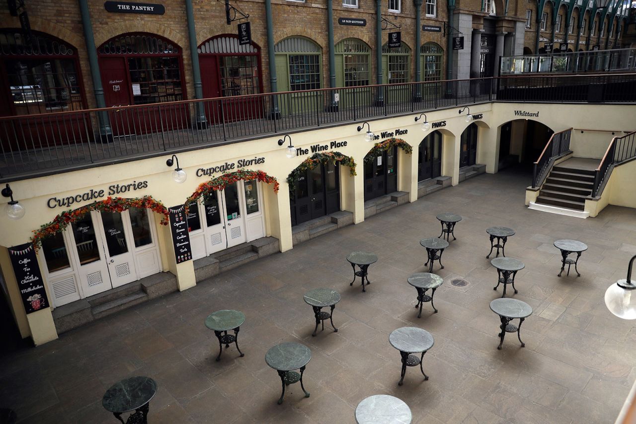 Tables stand empty, as restaurants and bars are closed due to the lockdown to try to stop the spread of coronavirus, in the south hall of Covent Garden, central London on April 20.