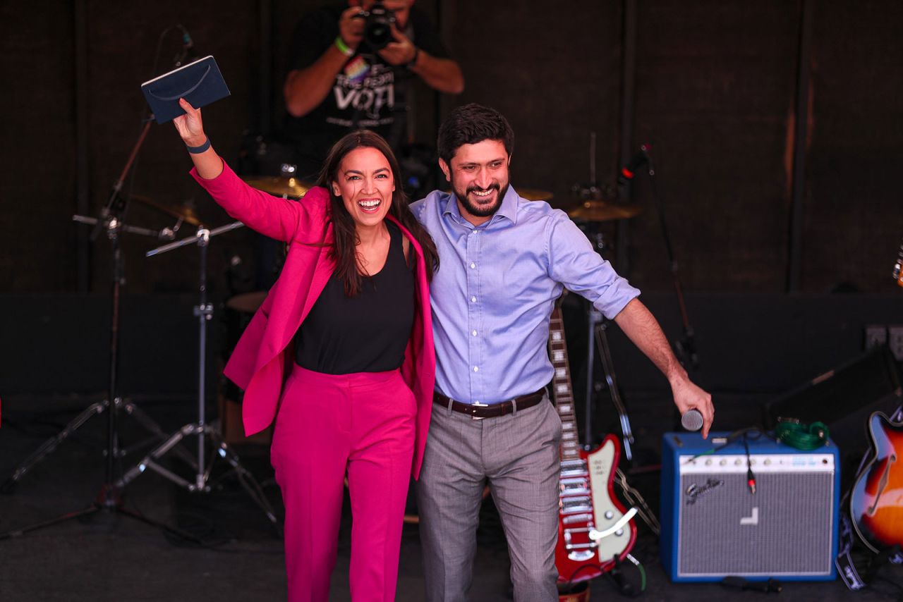 New York Rep. Alexandria Ocasio-Cortez and Greg Casar wave to a crowd at a campaign rally in Austin, Texas, on February 13. 