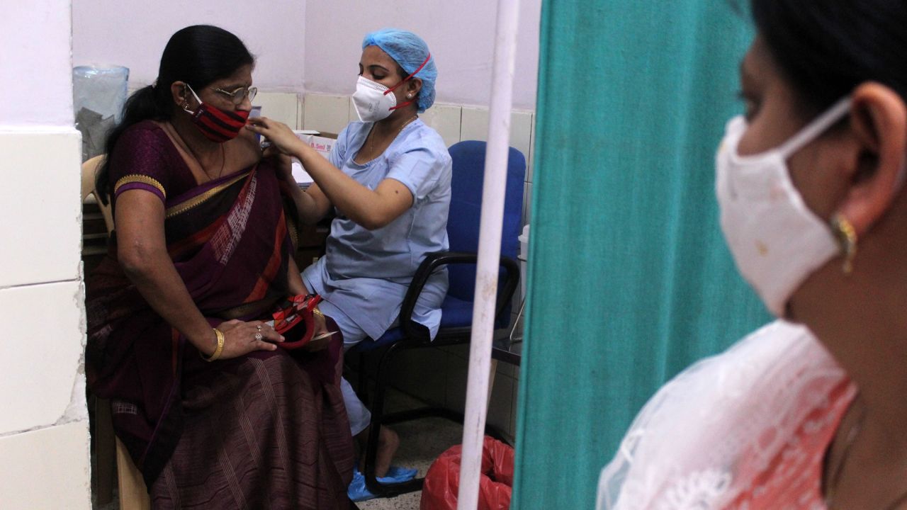 A woman receives a Covid-19 vaccine in New Delhi on Tuesday.