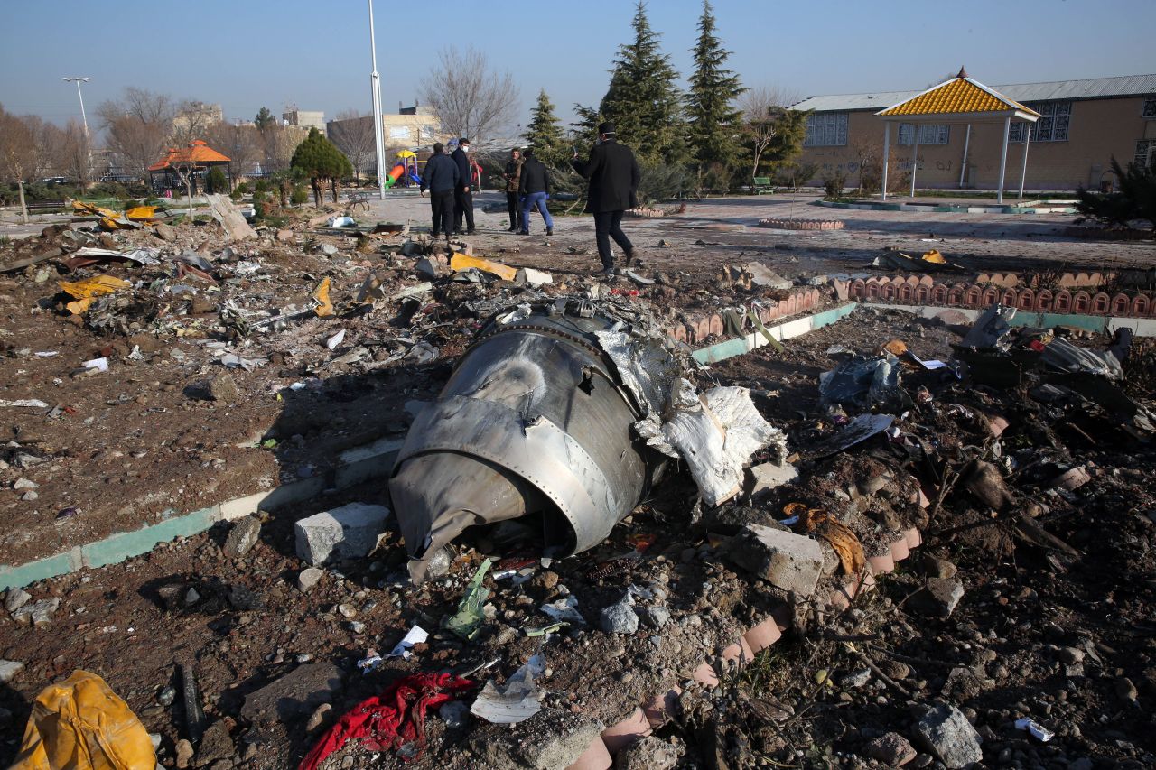 Rescue teams work amidst the debris from the plane crash near Imam Khomeini airport in Tehran, Iran, on January 8.