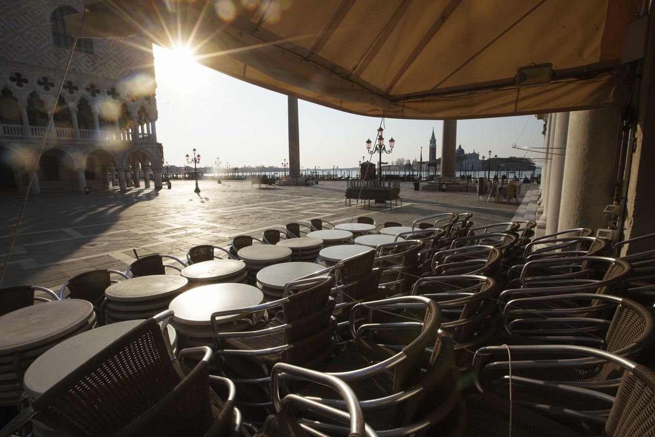 Chairs and tables are piled in front of a bar in St. Mark's Square in Venice on April 6, during a lockdown to prevent the spread of the coronavirus.