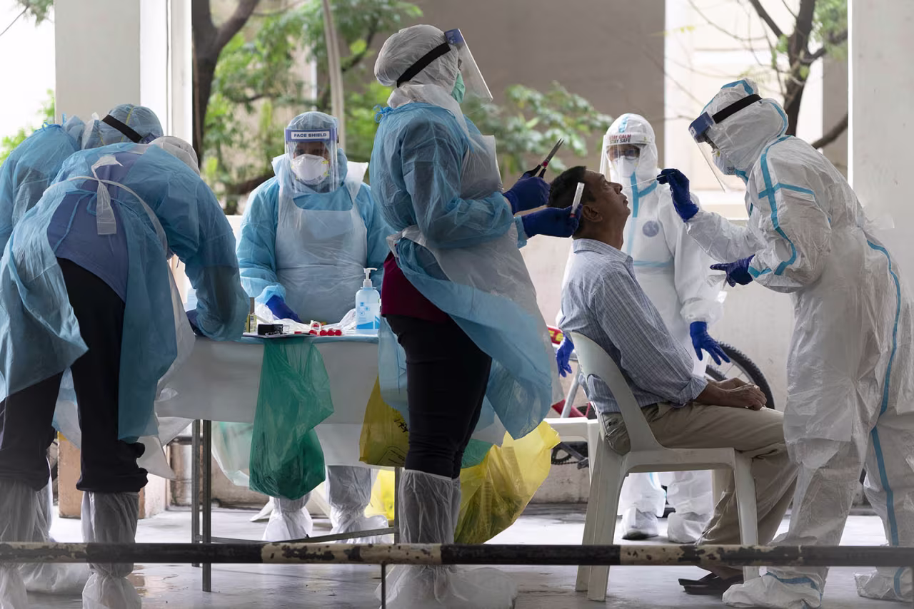Health ministry staff collect sample for coronavirus testing from a resident at an urban area in Bandar Utama, outskirts of Kuala Lumpur, Malaysia on Thursday, October 22. 