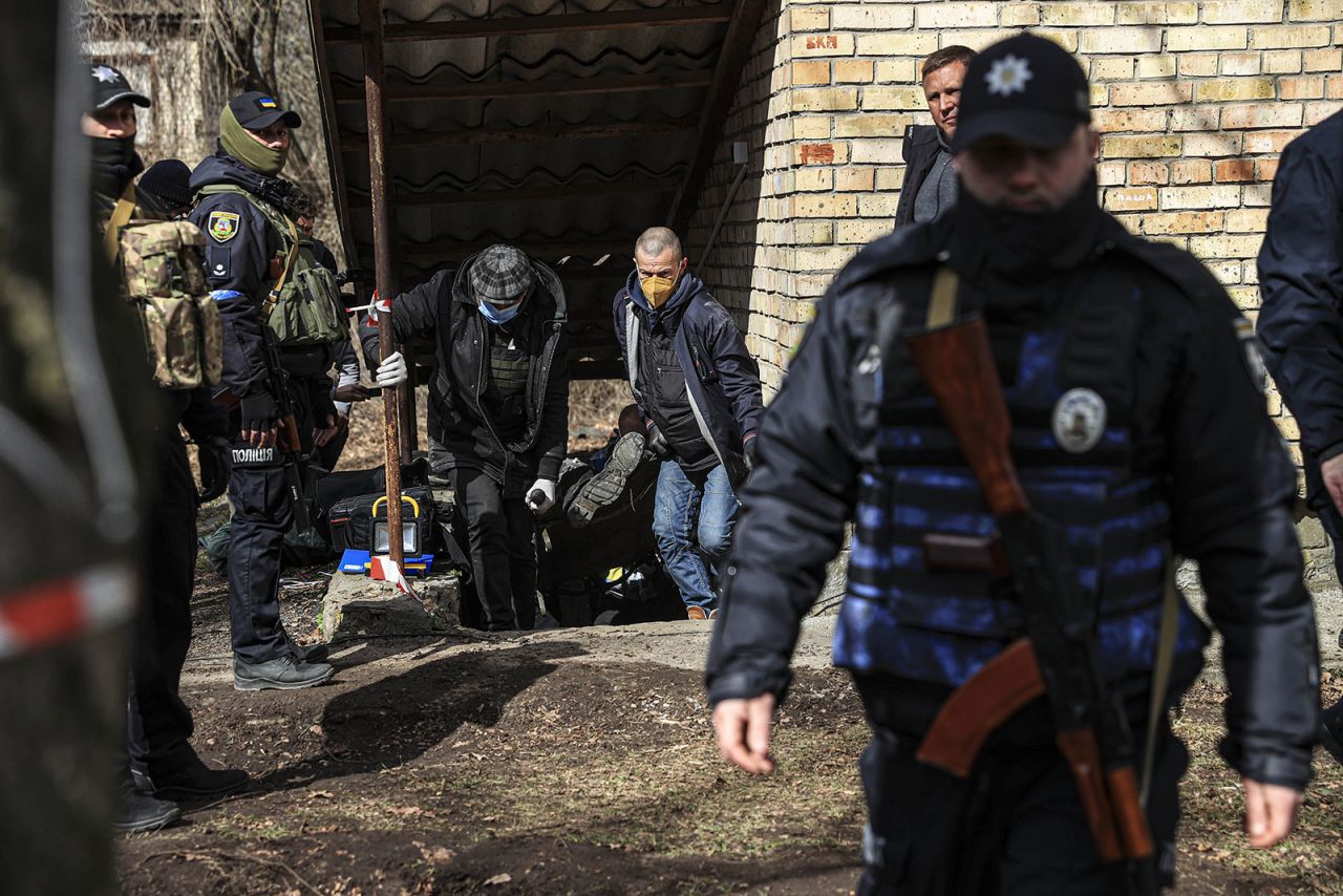 Bodies found in the town of Bucha were gathered to be buried on Monday.