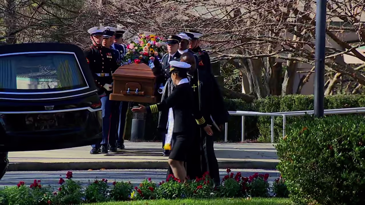 The the casket of Rosalynn Carter is placed in a motorcade on Tuesday.