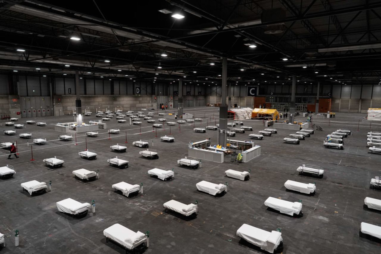 Health workers prepare to receive the first patients with coronavirus at Ifema exhibition complex on Sunday in Madrid, Spain.