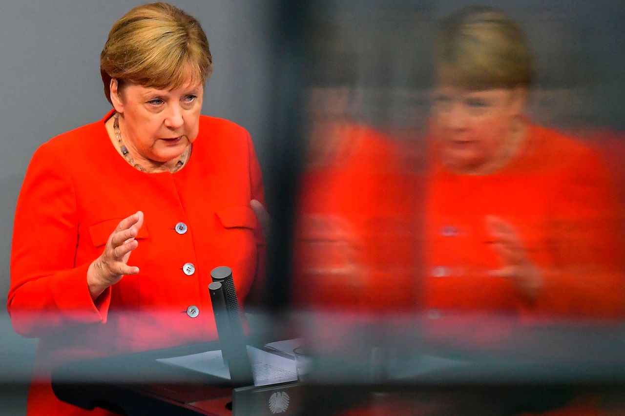 German Chancellor Angela Merkel speaks during a sitting of the Bundestag, Germany's lower house of parliament in Berlin on June 18.