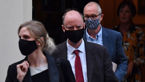 England Chief Medical Officer Chris Whitty, second from left, leaves 11 Downing Street in London on Monday.