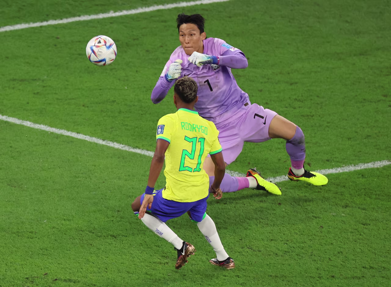 South Korea's Kim Seung-gyu saves a shot from Brazil's Rodrygo during the match between Brazil and South Korea at Stadium 974 on December 5.