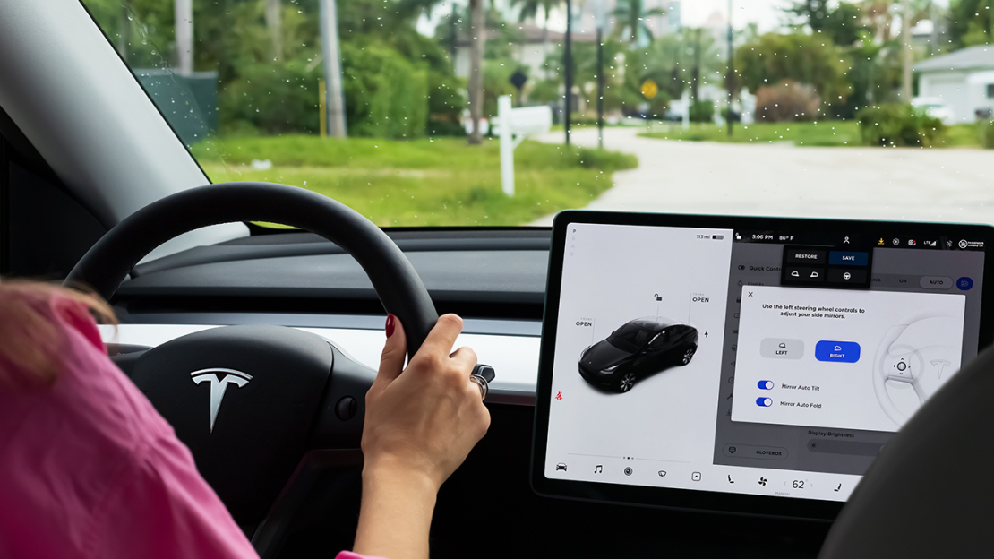 Cockpit with LCD touch screen of Tesla Model Y electric car driving in Miami