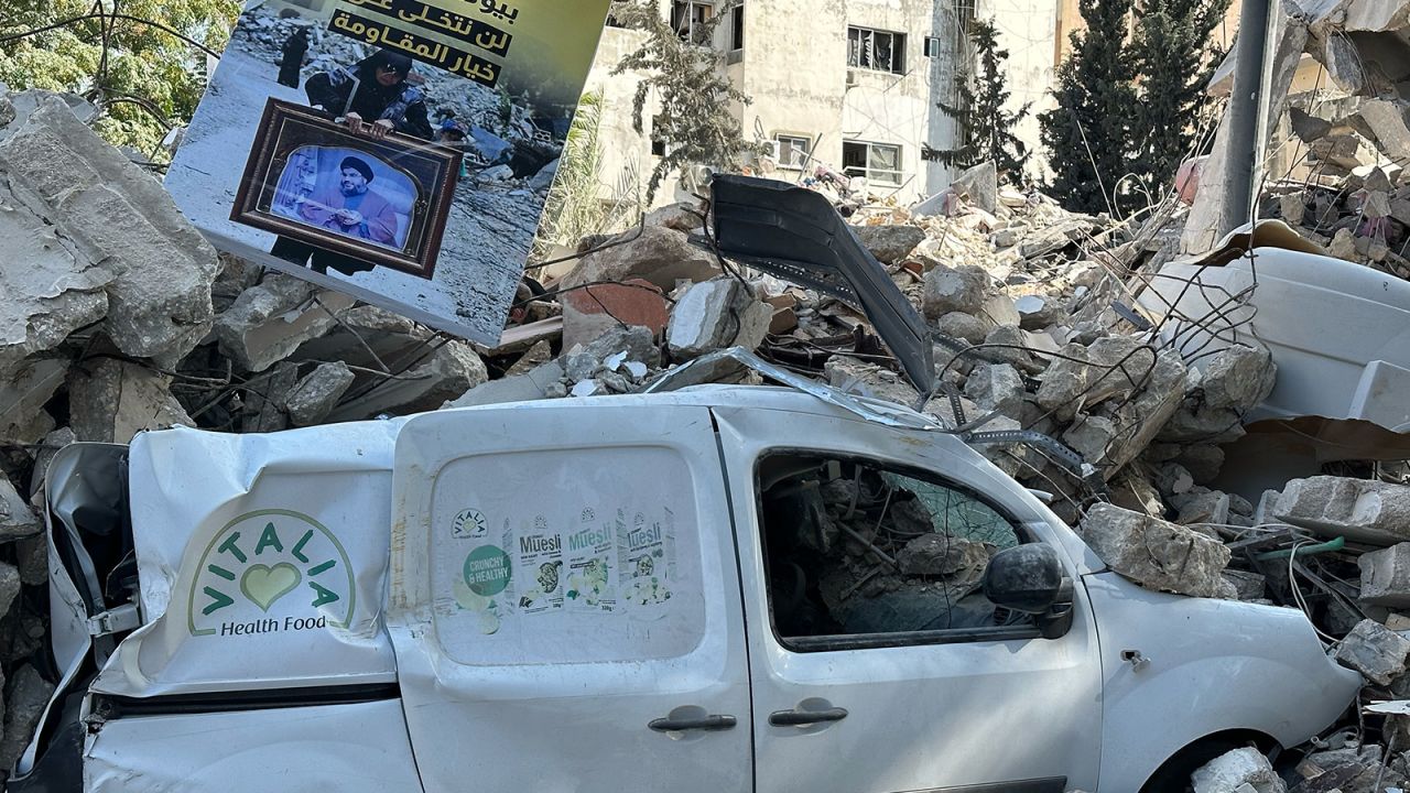 A white van was destroyed by the blast is trapped under the rubble.