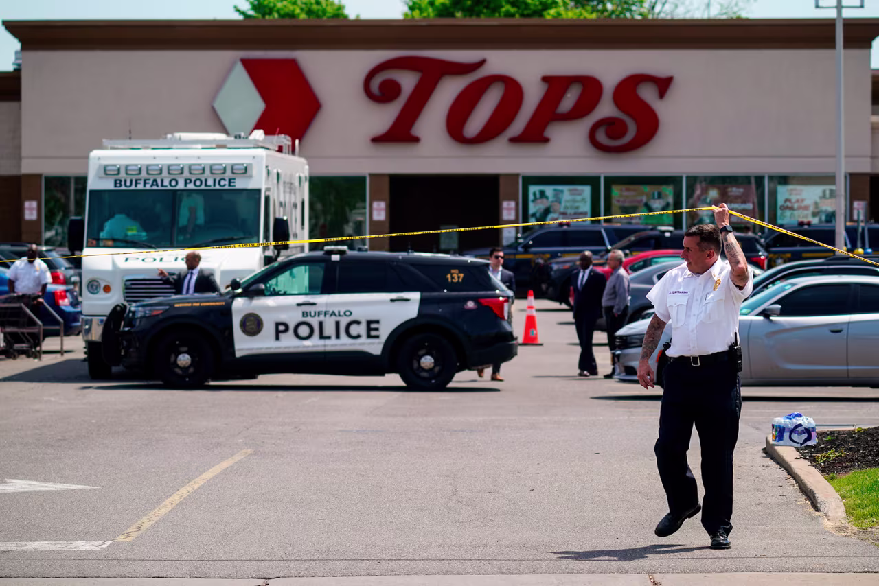Police secure the scene of a shooting at Tops supermarket in Buffalo, New York, on May 15. 