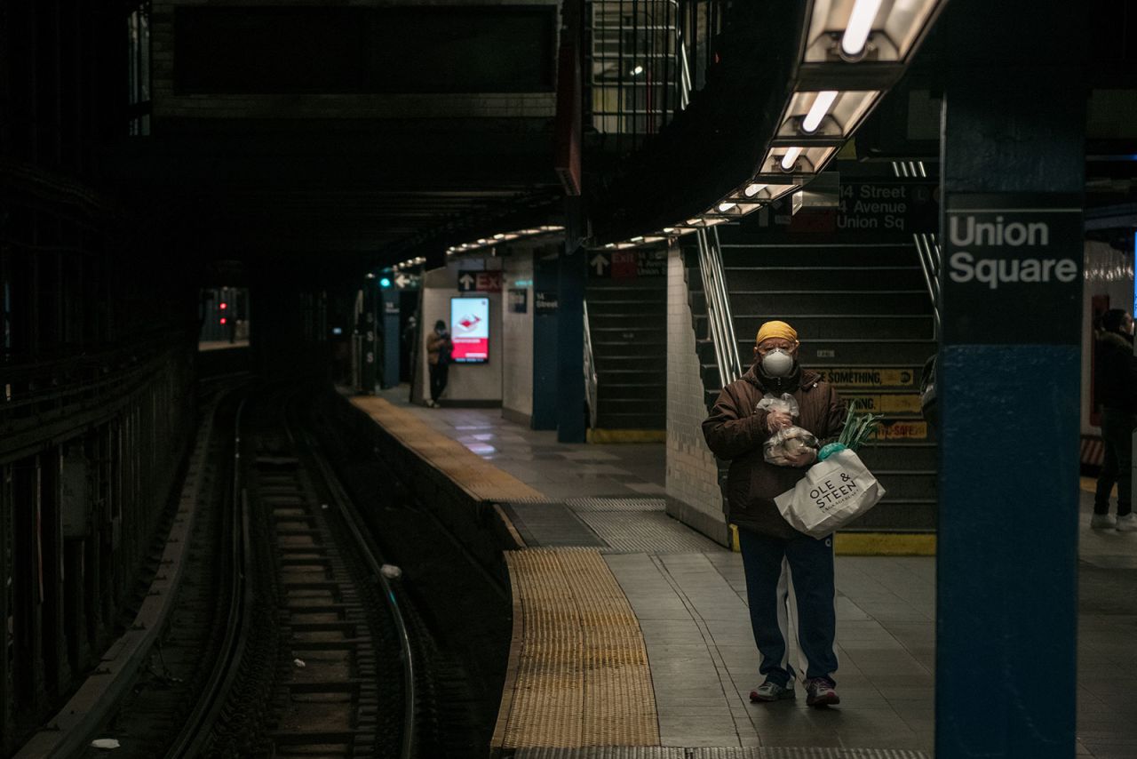 A person waits for the train at a subway station in New York City on April 17.