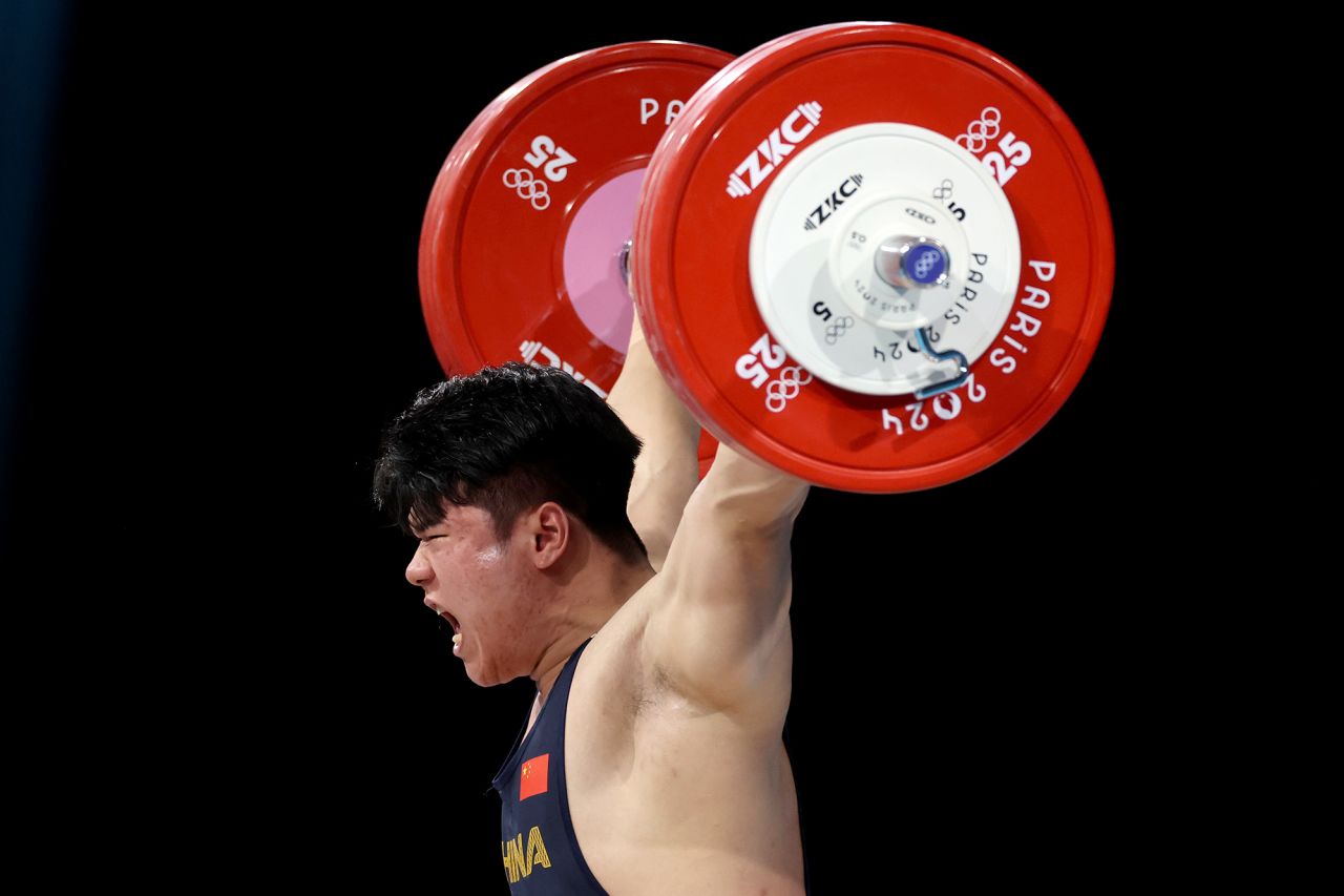 China’s Liu Huanhua performs a snatch during the men’s 102kg weightlifting final on August 10. 