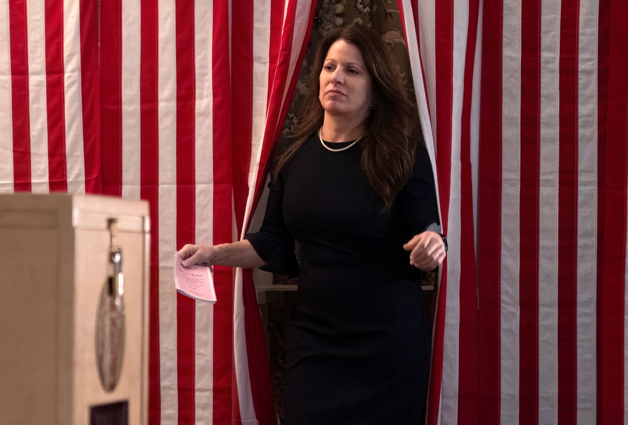 Annmarie Pintal Turcotte exits the voting booth to cast her ballot in Dixville Notch, New Hampshire, just after midnight Tuesday.