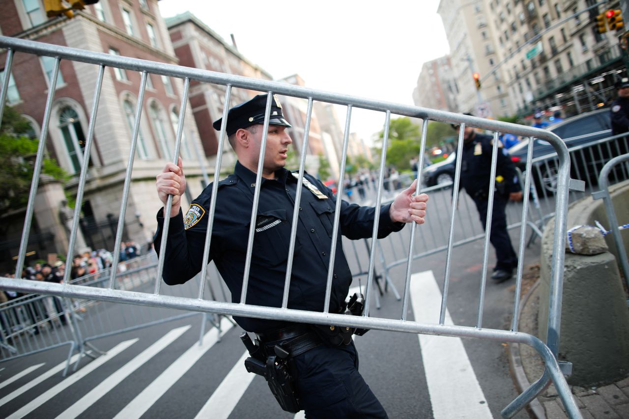 NYPD officers set fences near Columbia University where pro-Palestinian students are barricaded inside a building and have set up an encampment in New York City on April 30, 2024.