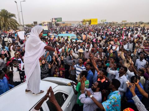 Alaa Salah, a Sudanese woman propelled to internet fame earlier this week after clips of her leading powerful protest chants against Bashir went viral, addresses protesters during a demonstration in front of the military headquarters on Wednesday, April 10. 