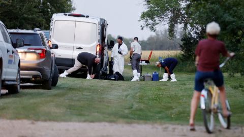 A police forensics team investigates a crime scene in Weldon, Saskatchewan, on Sunday.
