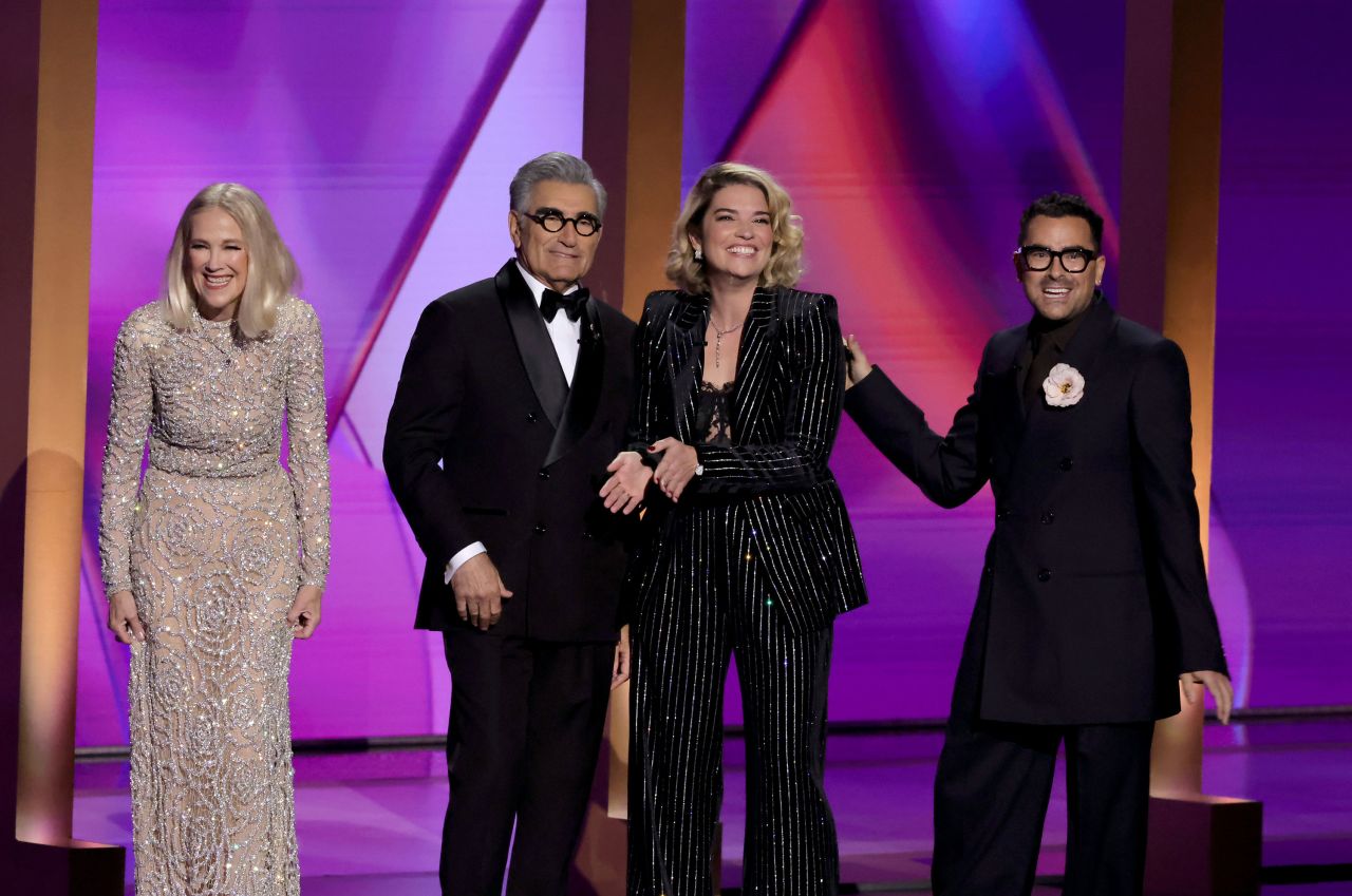 Catherine O'Hara, Eugene Levy, Annie Murphy and Dan Levy speak on stage. 