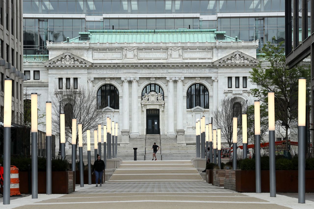 A person walks along a nearly empty street in Washington, DC, on March 27.