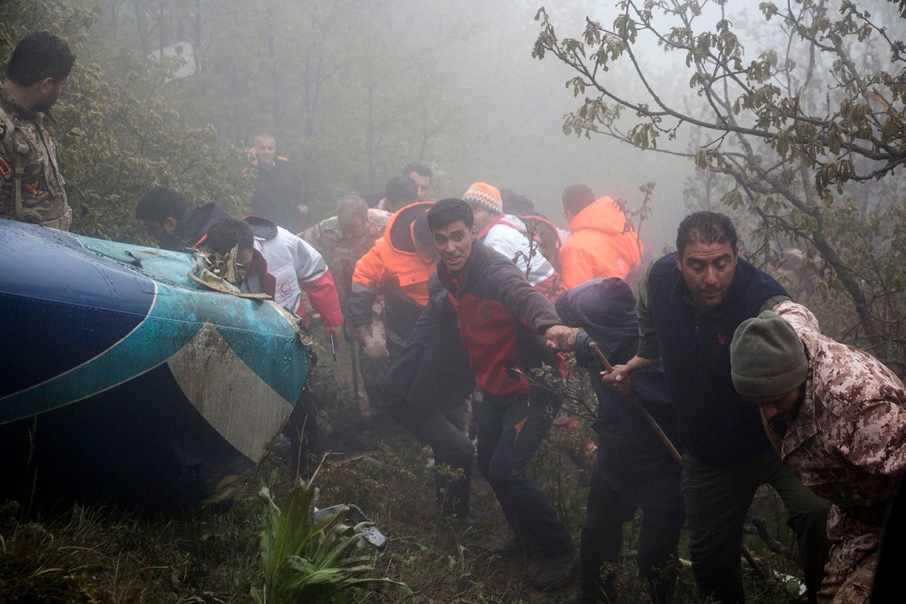 In this photo provided by Moj News Agency, rescue team members work at the scene of a crash of a helicopter carrying Iranian President Ebrahim Raisi in Varzaghan in northwestern Iran on May 20.