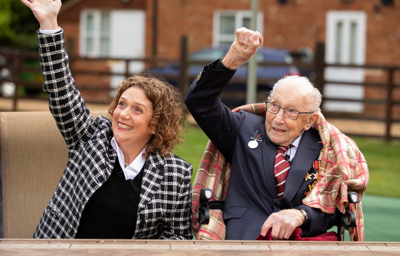 Colonel Tom Moore and his daughter Hannah celebrate his 100th birthday with an RAF flypast over his home in Marston Moretaine, England on April 30.