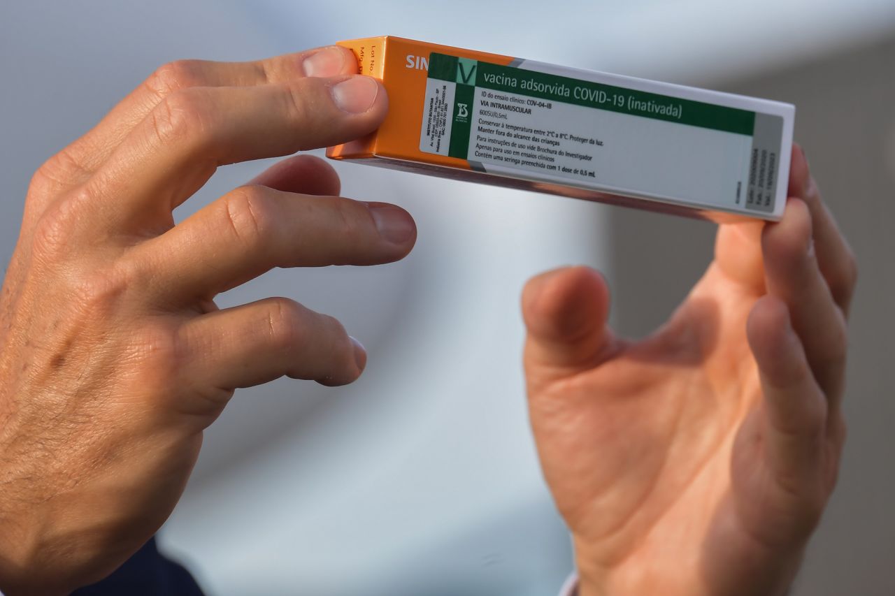 Sao Paulo Governor Joao Doria shows to members of the media a package of the CoronaVac vaccine at Guarulhos International Airport in Guarulhos, Brazil, on December 3, 2020.