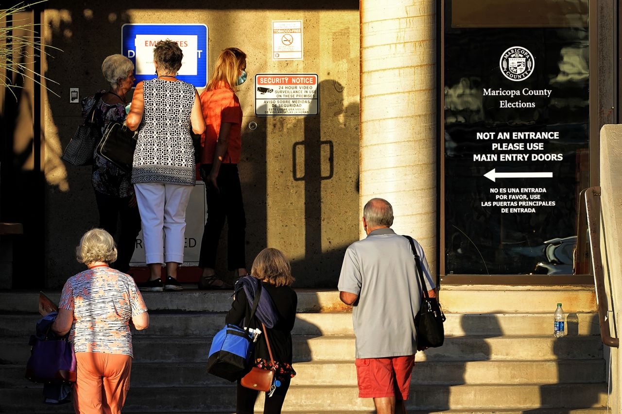 Election officials arrive for work at the Maricopa County Recorder's Office on Thursday, November 5, in Phoenix.