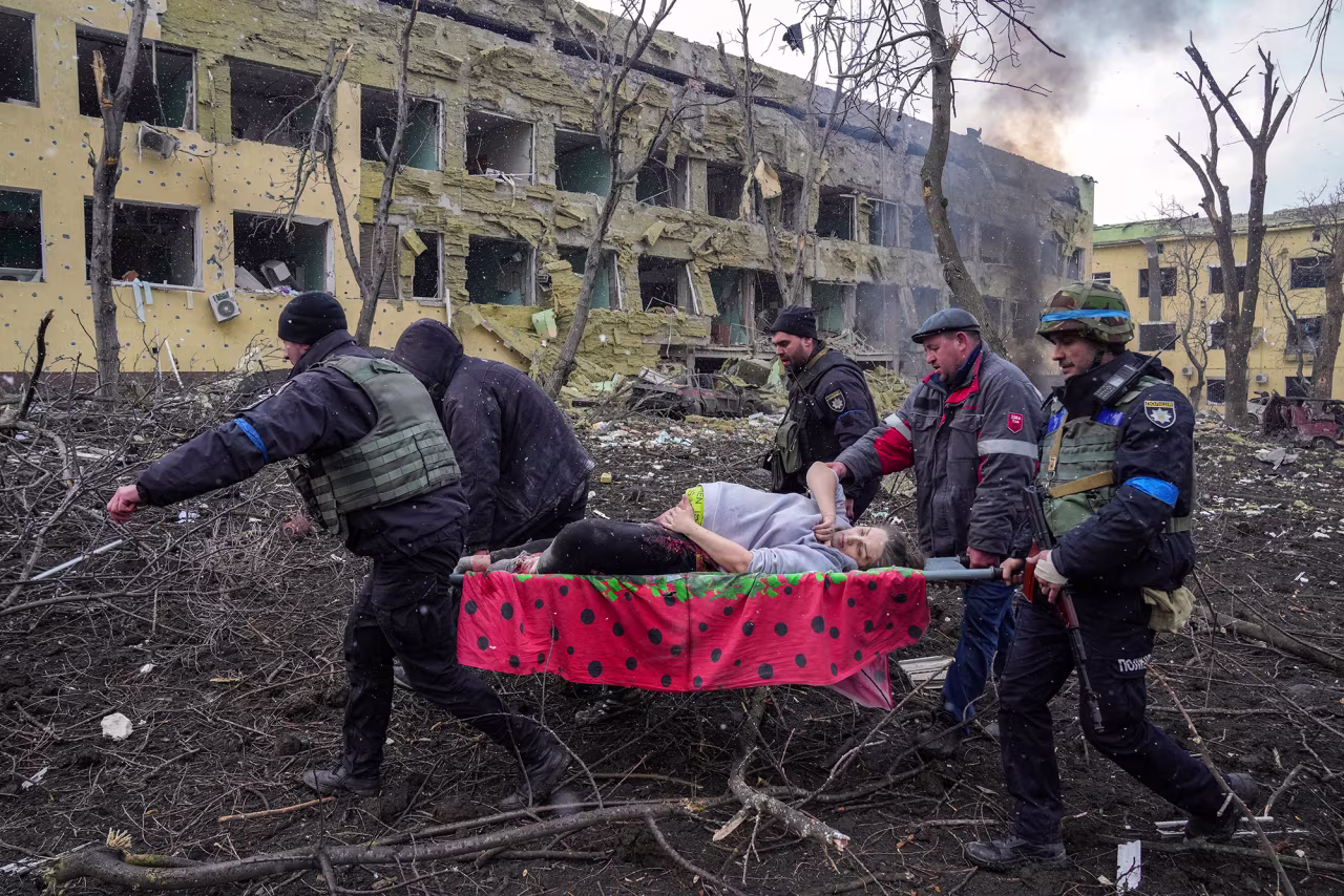 Iryna Kalinina is carried from a maternity hospital that was damaged during a Russian airstrike in Mariupol, Ukraine, on March 9, 2022. 