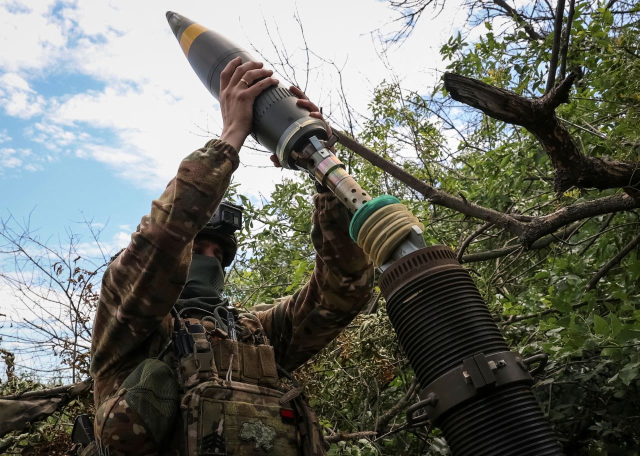 A Ukrainian serviceman prepares to fire a mortar at Russian positions on the front line near the city of?Bakhmut on July 13.