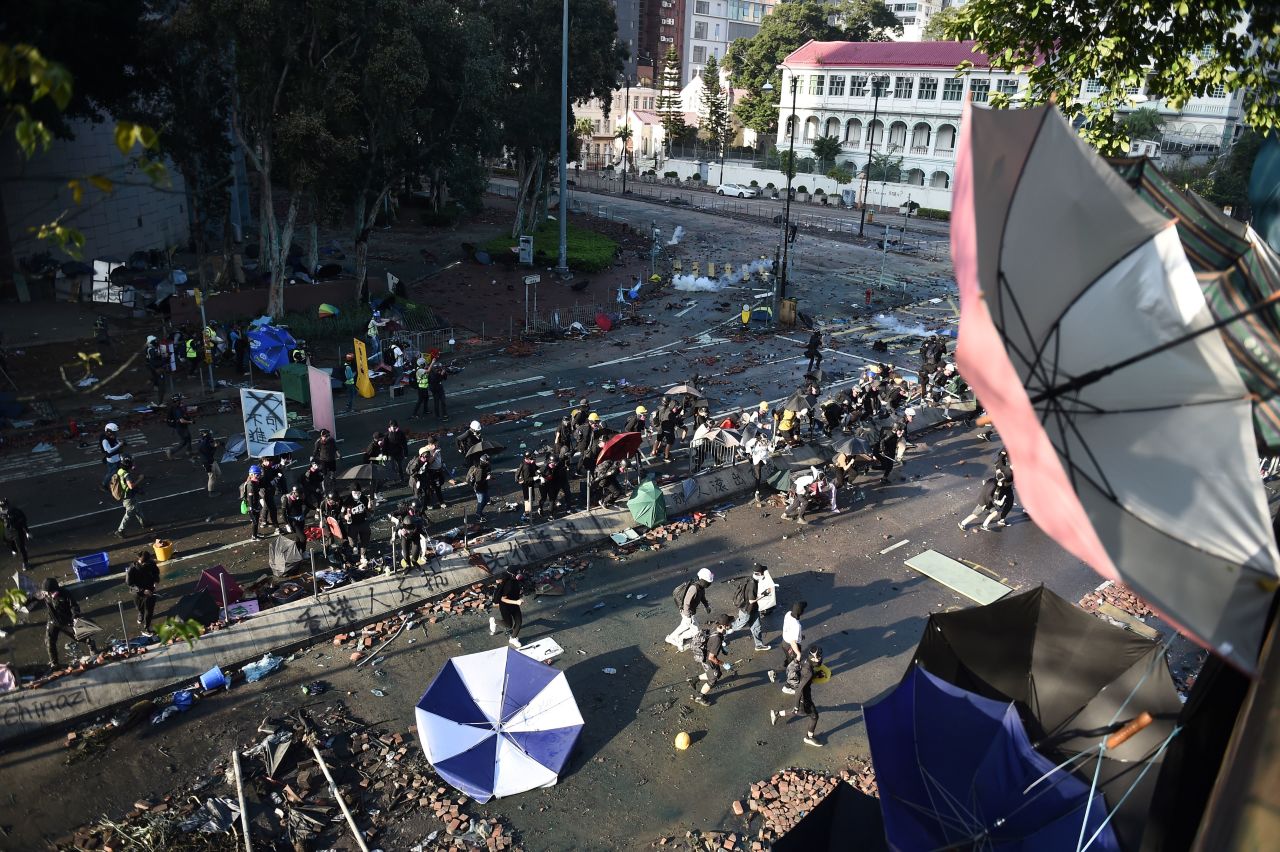 A large group of anti-government protesters try to find safe passage out of Hong Kong Polytechnic University and dodge police in Hung Hom district of Hong Kong on November 18.
