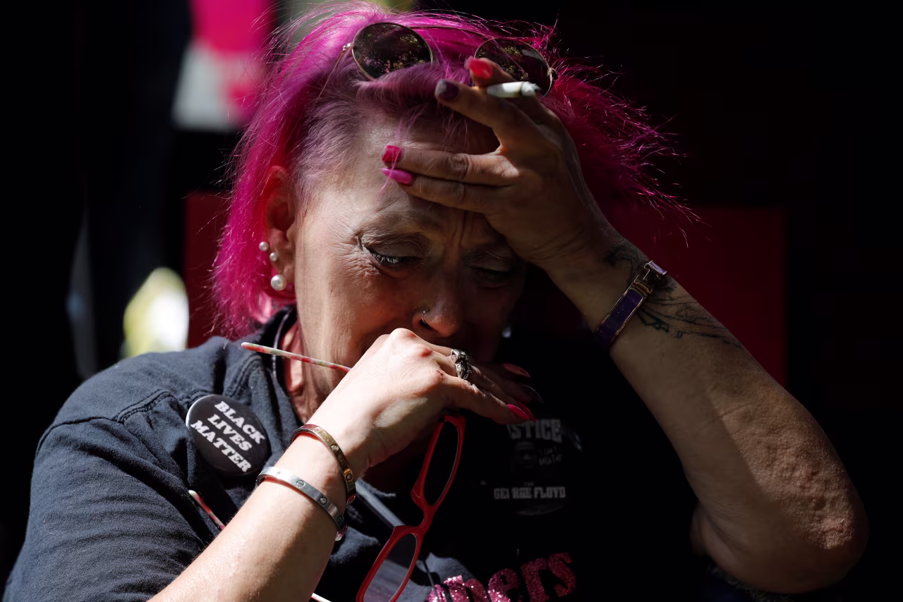 A person reacts outside Hennepin County Government Center in Minneapolis after Chauvin's sentencing.