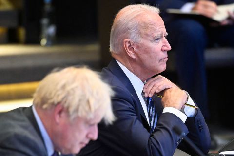 Biden and UK Prime Minister Boris Johnson attend the NATO summit in Brussels on Monday.
