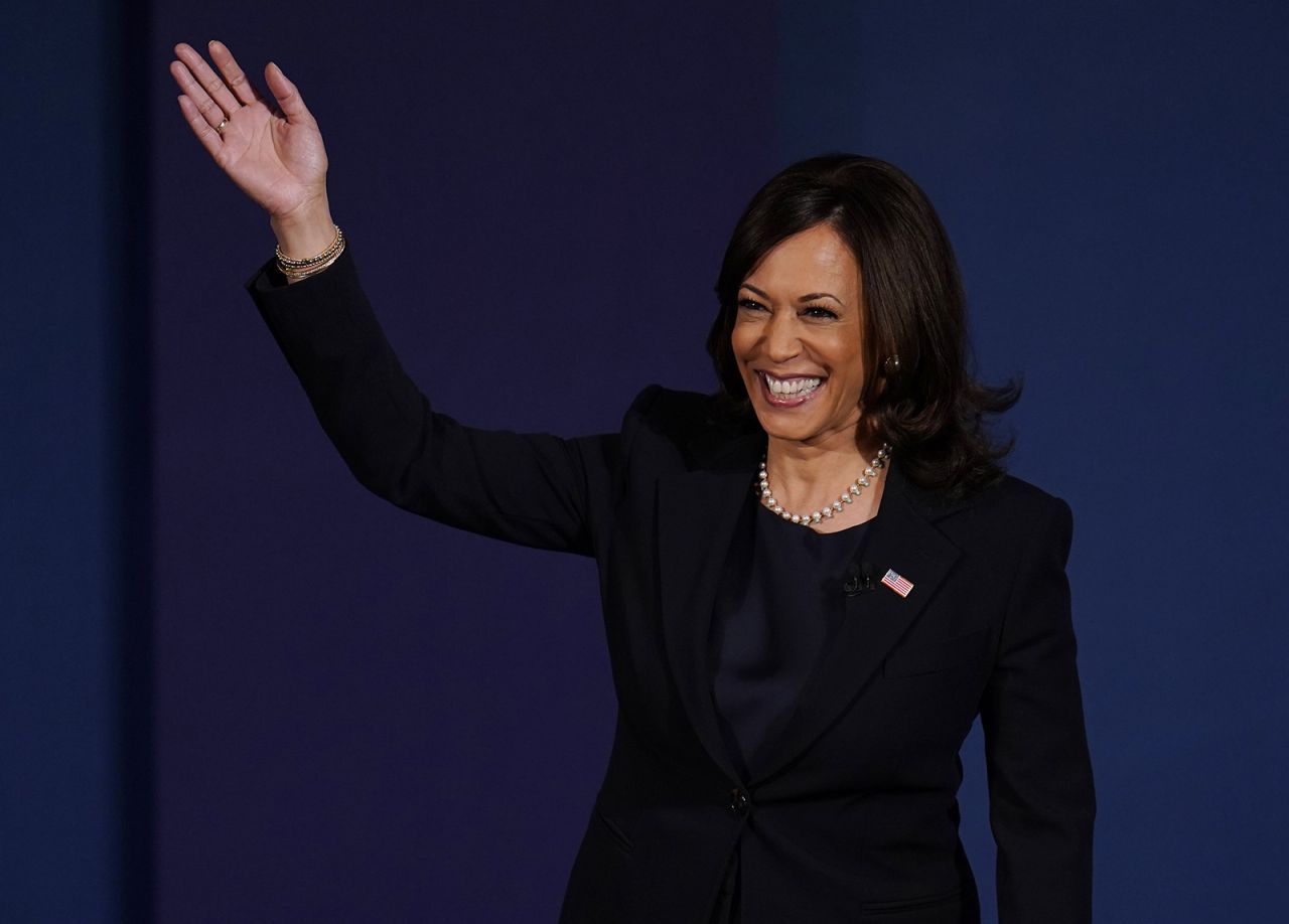 Democratic vice presidential candidate Sen. Kamala Harris waves as she arrives on stage for the vice presidential debate with Vice President Mike Pence on Wednesday, Oct. 7, at Kingsbury Hall on the campus of the University of Utah in Salt Lake City.