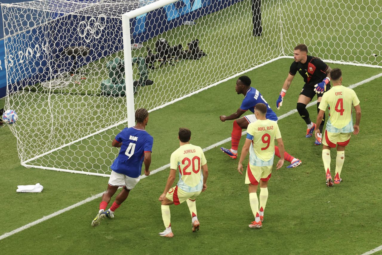 Spain's concedes a goal scored by France's Maghnes Akliouche in the men's gold medal final.