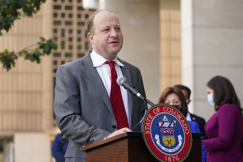 Colorado Governor Jared Polis speaks during a news conference about the the state's efforts to protect the process of casting a vote in the upcoming general election Thursday, Oct. 15, in downtown Denver. 