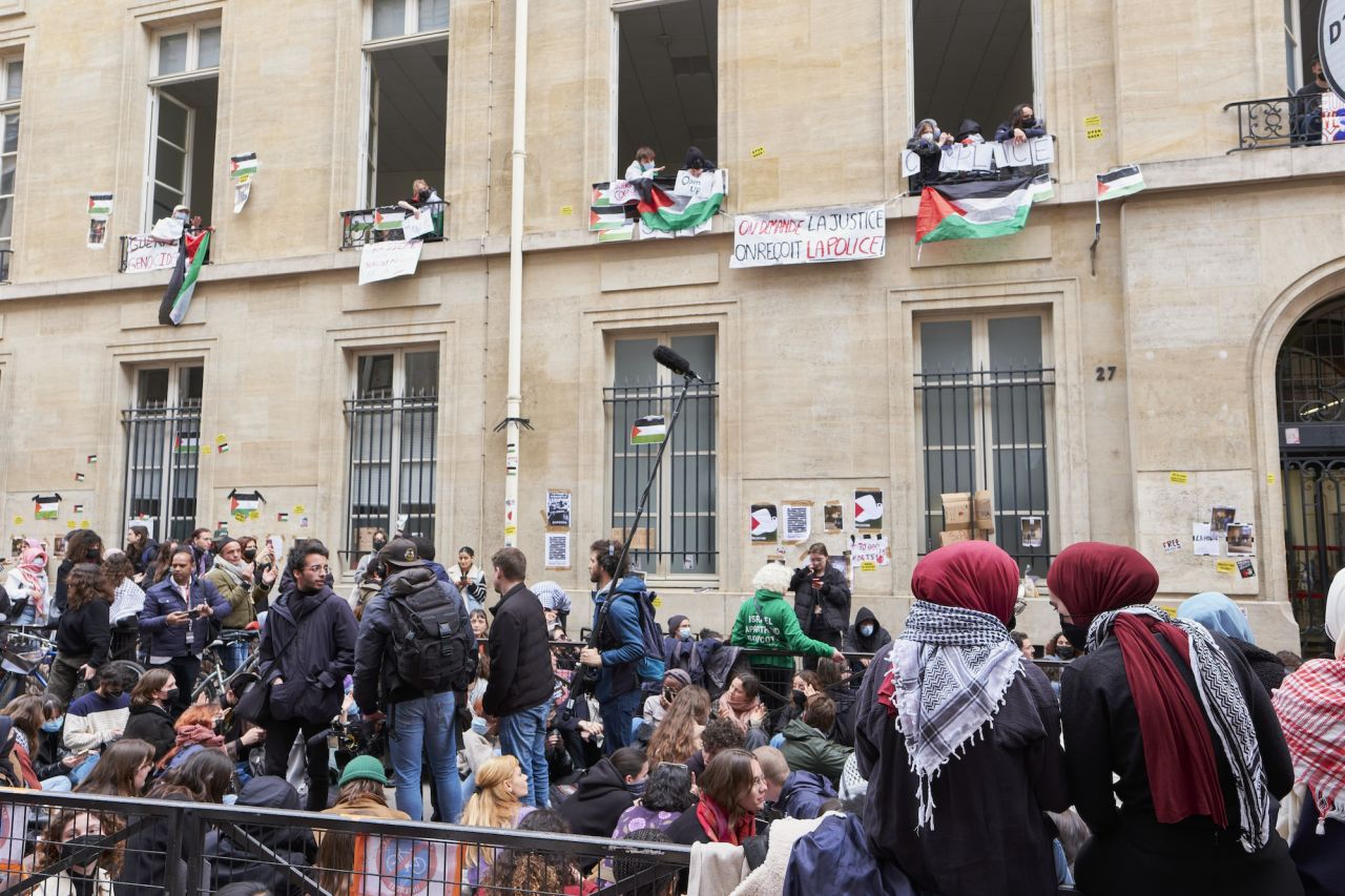 ?Students are seen in front of the Sciences Po University in Paris on Friday.