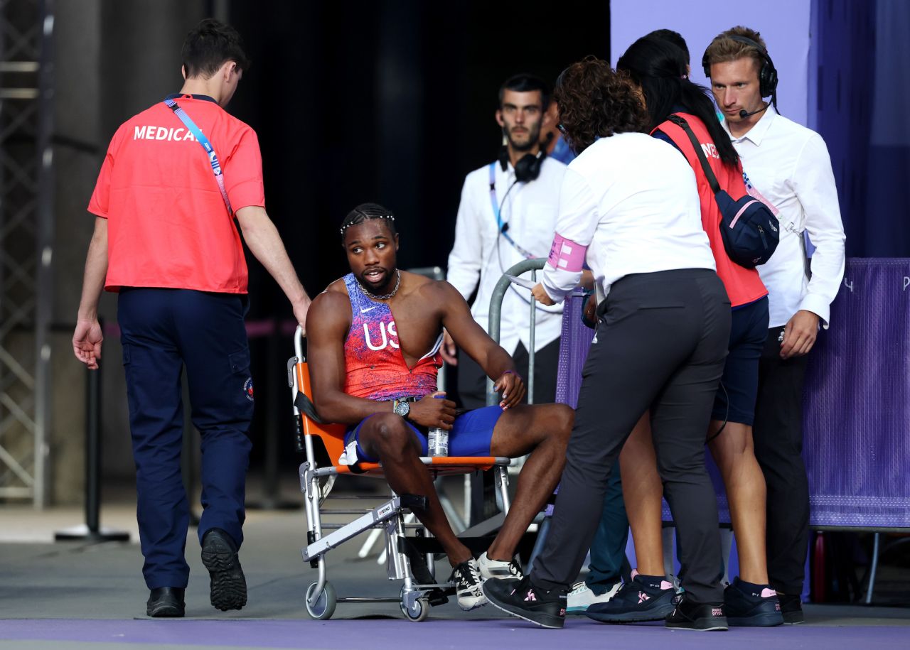 Noah Lyles is taken off from the track with a wheelchair.