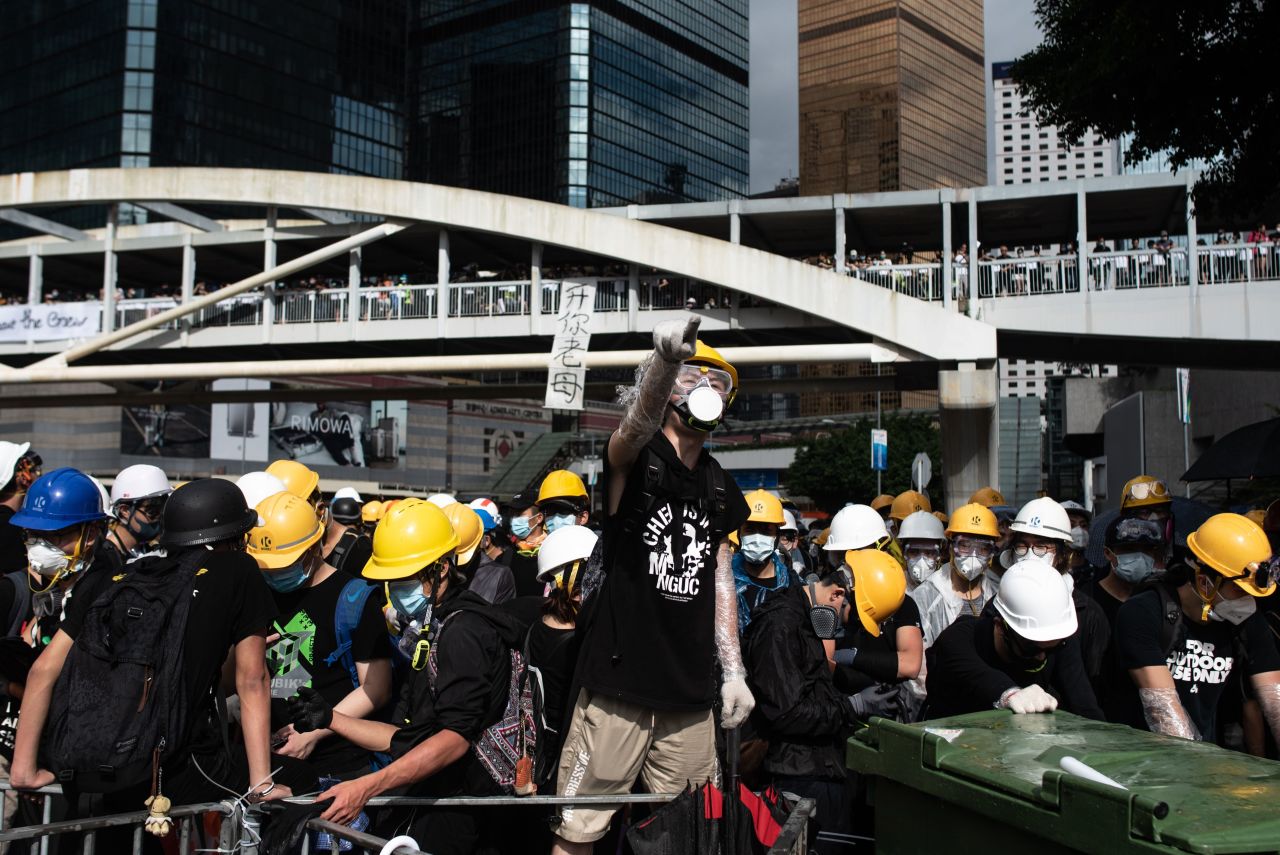 Protesters chant slogans on Harcourt Road outside the government headquarters after the annual flag raising ceremony to mark the 22nd anniversary of the city's handover from Britain to China, in Hong Kong on July 1.