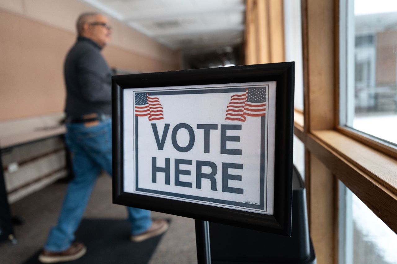 A sign directs voter to an early voting site on February 17, in Battle Creek, Michigan.