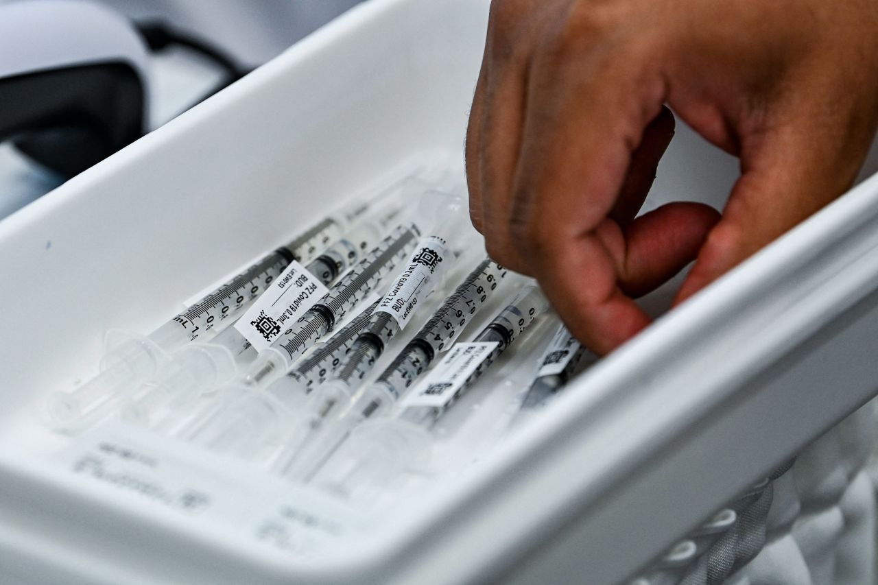 Pharmacy student Jason Rodriguez prepares Pfizer vaccines at the Christine E. Lynn Rehabilitation Center in Miami on April 15.