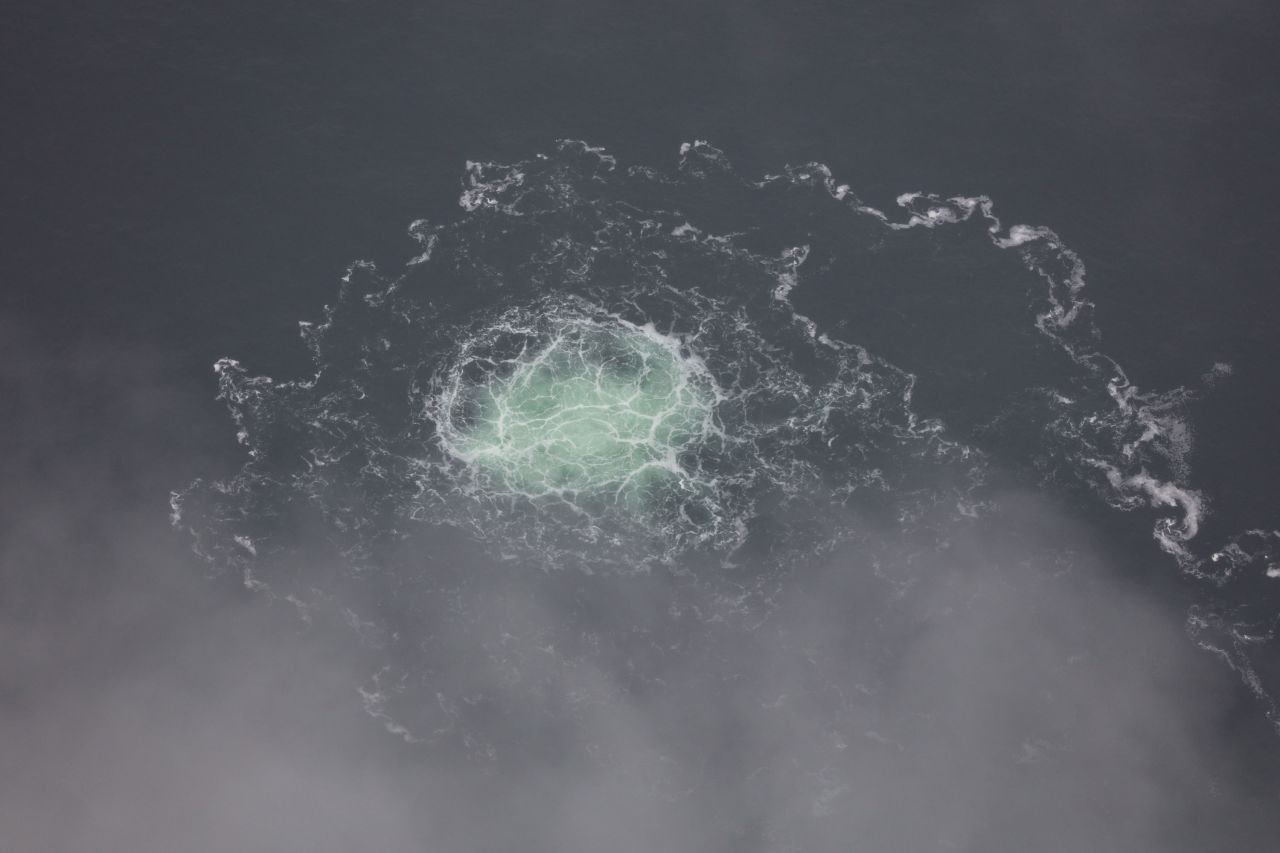 In this photo provided by Swedish Coast Guard, the release of gas emanating from a leak on the Nord Stream 2 gas pipeline in the Baltic Sea on September 28, 2022. A fourth leak was detected in the undersea gas pipelines linking Russia to Europe, after explosions were reported earlier that week in suspected sabotage.