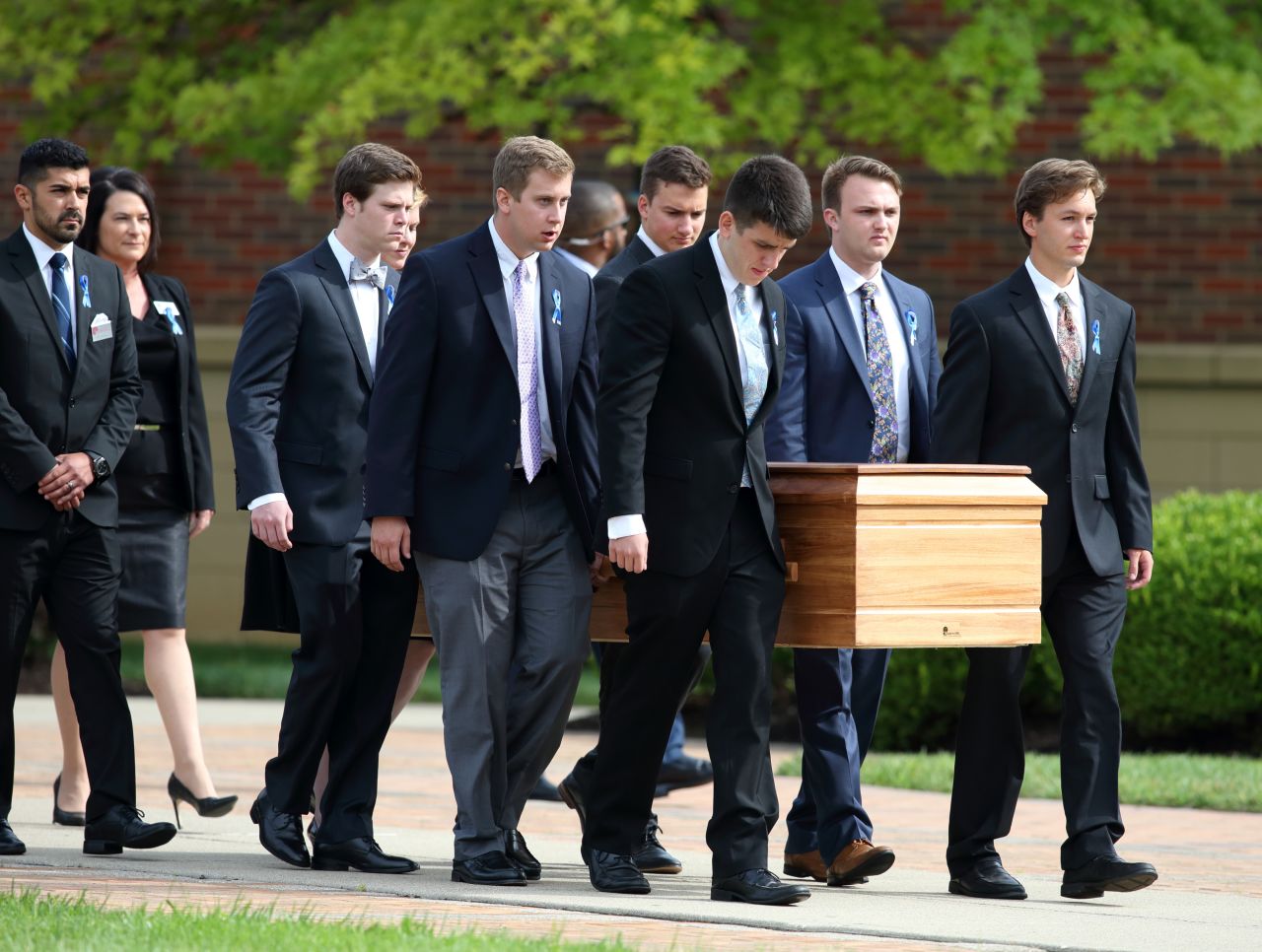 The casket carrying the remains of Otto Warmbier is carried out of Wyoming High School in Wyoming, Ohio on June 22, 2017, following the funeral for Warmbier.