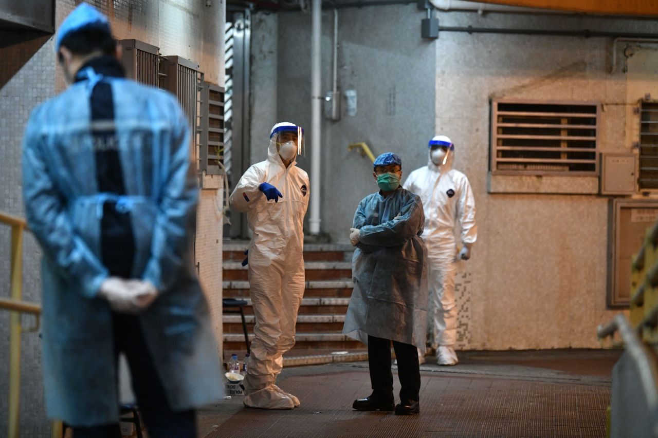 Medical staff at a housing estate in Hong Kong, after two residents were confirmed to have novel coronavirus on February 11, 2020.