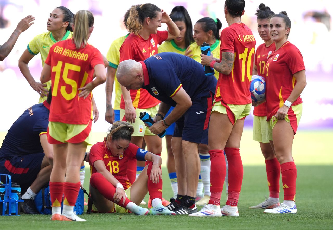 Olga Carmona of Spain is tended to after being fouled by Marta on Wednesday.