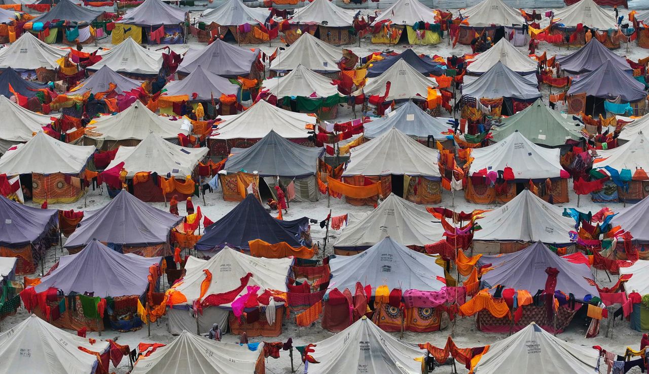 Hindu devotees stay in tents at a camp for people arriving to attend the temple's opening in Ayodhya, India, on Friday.