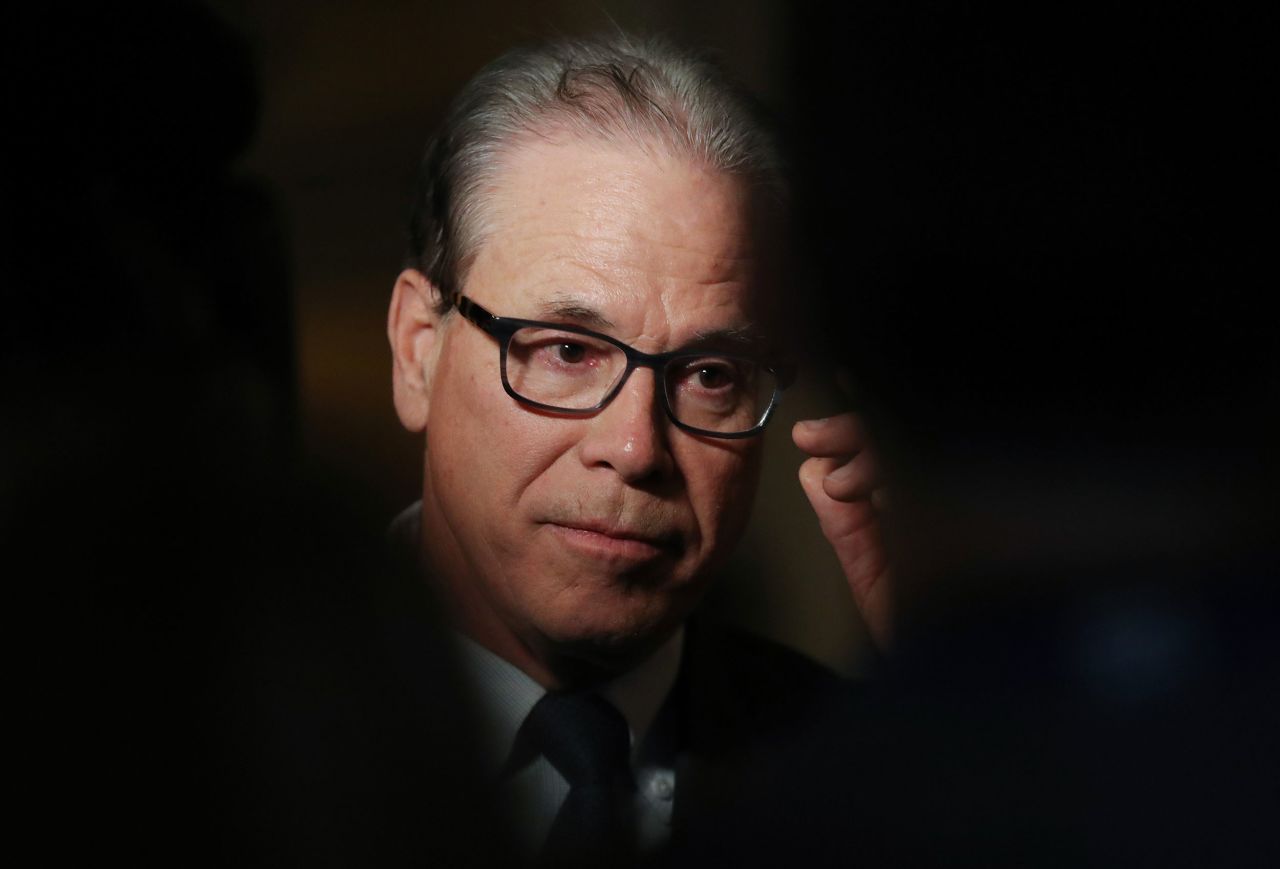 Sen. Mike Braun speaks to the press during a break in the impeachment trial on Monday.